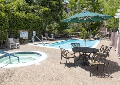 apartment complex pool with safety grip handrail cover