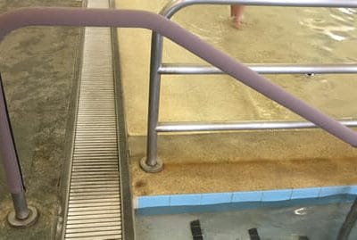 pool handrail cover on railing in gym pool